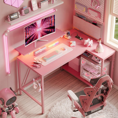 RSPGAME 42" L Shaped Computer Desk with Power Outlets, Corner Office Desk with LED Lights & Monitor Stand, Reversible Shelves, Corner Desk for Small Spaces ,Bedrooms & Home, Carbon Fiber Pink