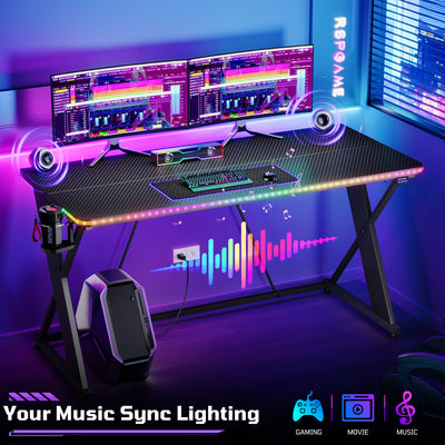 RSPGAME 55" Music Sync Gaming Desk with LED Lights, Gamer Table with Cup Holder & Headphone Hook, X-Shape Home Office PC Computer Desk, Carbon Fiber Black